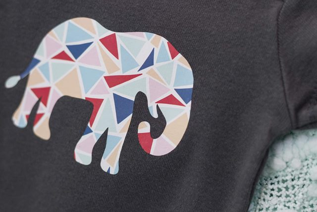 Iron on Paper Packs elephant design on gray shirt.