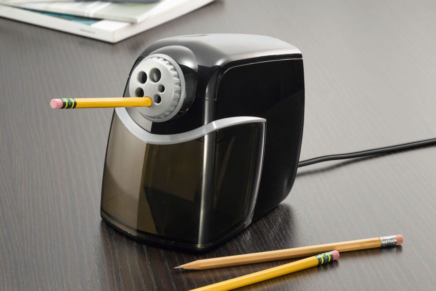 Close up shot of electric pencil sharpeners with pencils on the side.