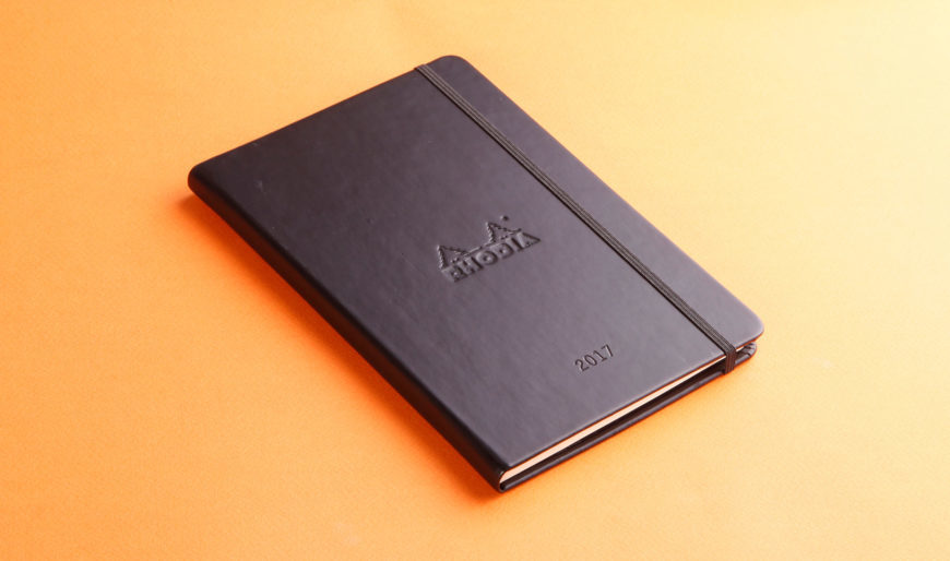 Notebook in orange background