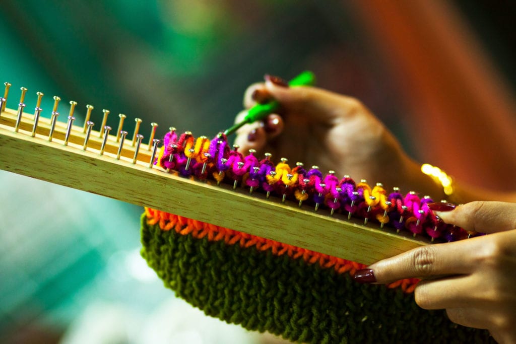 Woman Using Crochet Hooks