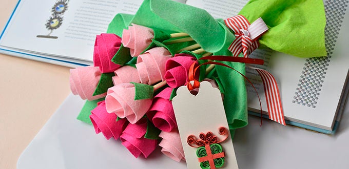 A Felt Flower Bouquet on top of a book.