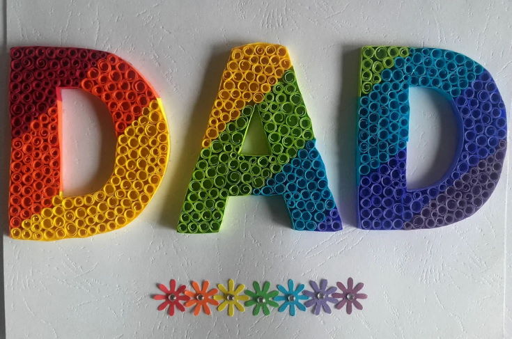 colorful word DAD in white background