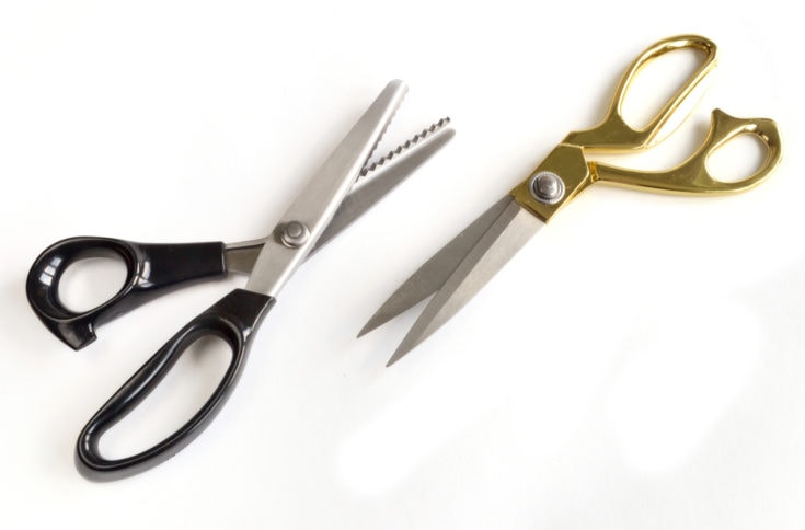 A pair of tailor's scissors isolated on a white background