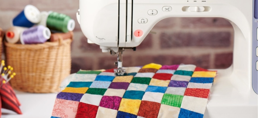 Sewing Machine for Quilters with basket of threads at the back