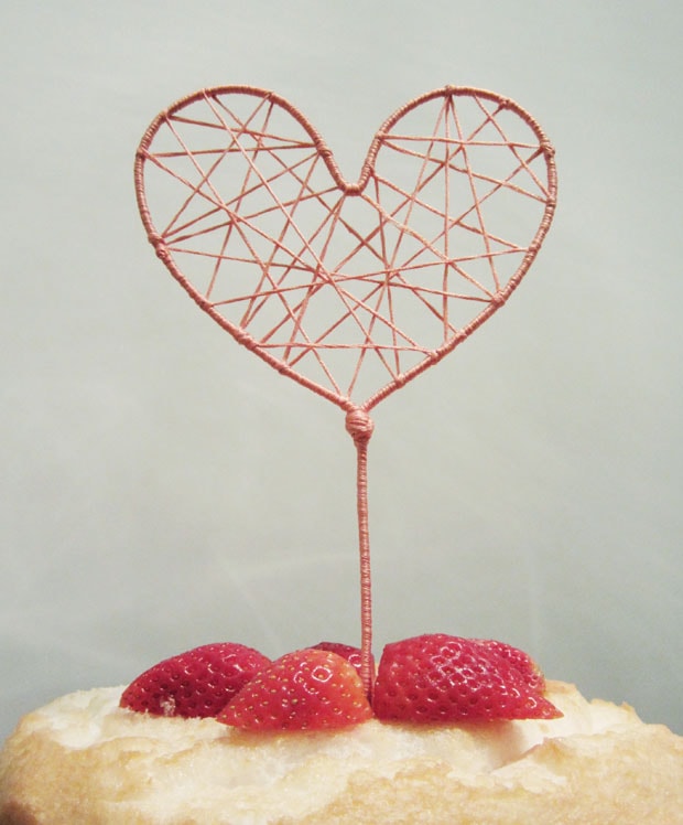 Heart-shape cake topper string art.