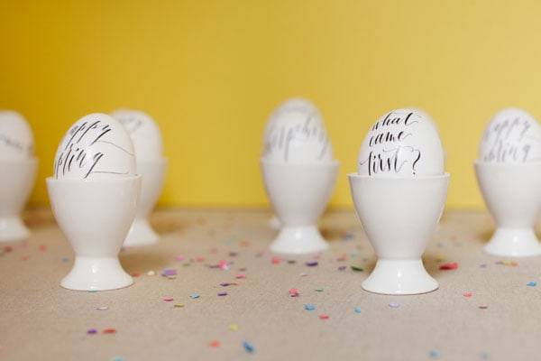 Calligraphy Eggs in a yellow background selective focus