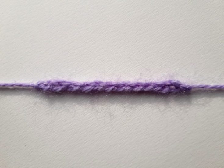 Purple yarn crocheted in the Chain stitch