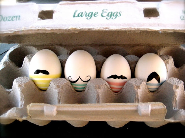 Classy Mustachioed Eggs 4 pieces in an egg tray