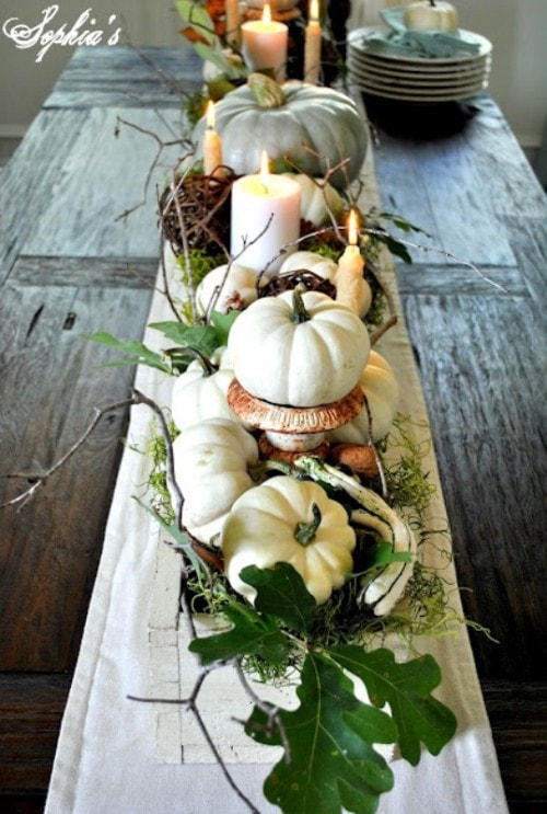 White and cream colors combined with natural wood and burlap table centerpiece