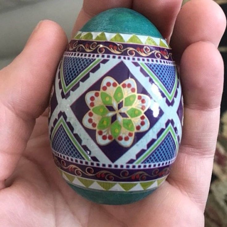 a close up shot of a person's hand holding a DIY Easter Egg kit wood - Wooden Pysanky Pisanky kit