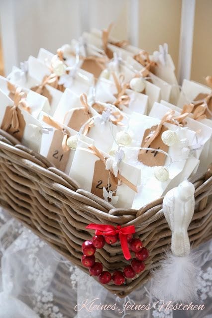 White paper bags tied with brown ribbon inside a wicker basket