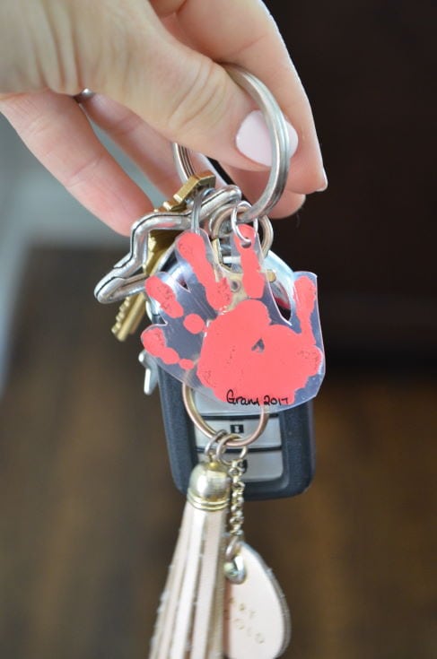 woman's hand holding key chains