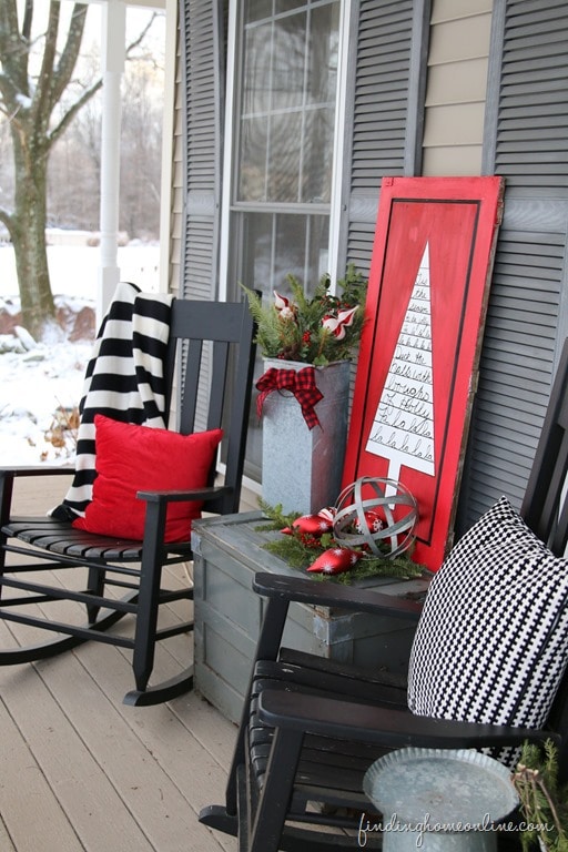 DIY outdoor Christmas sign with black porch chairs