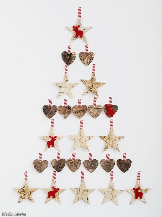 Heart and Stars form as Christmas tree on a white wall