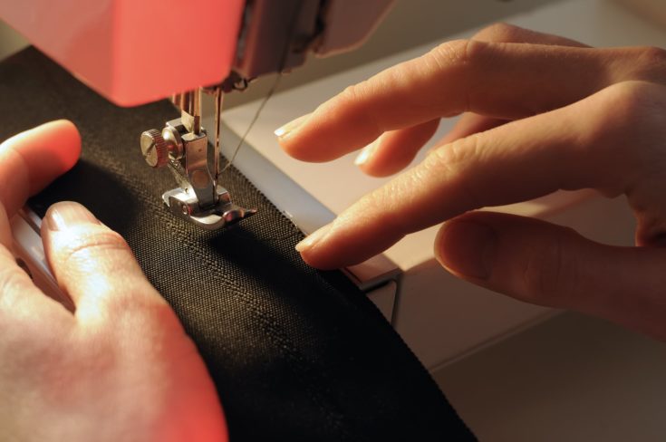 Tailor at Work on Sewing Machine