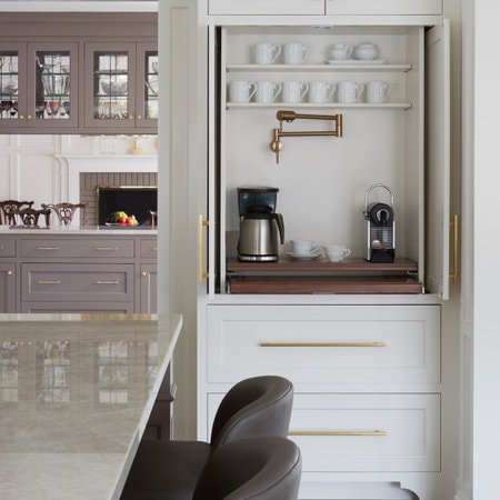 Corner coffee station with mugs and a coffee maker