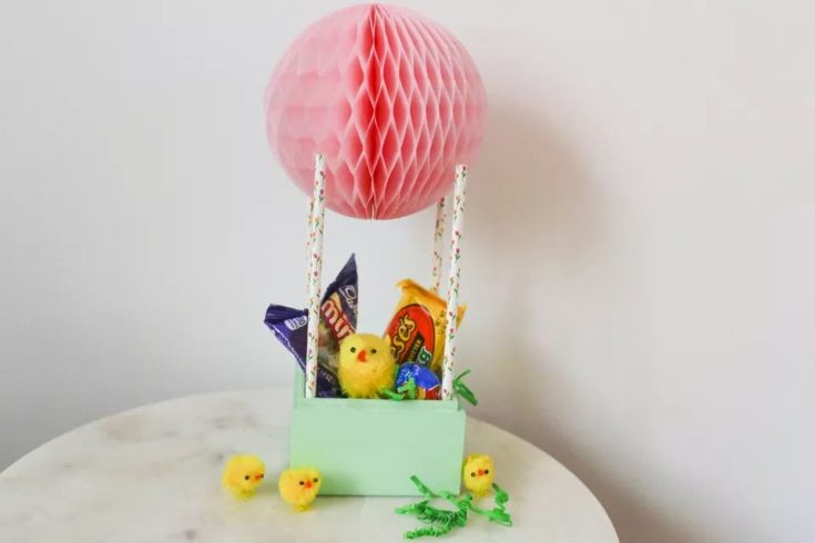 DIY Easter Basket Hot Air Balloon filled with chocolates and miniature chicks.