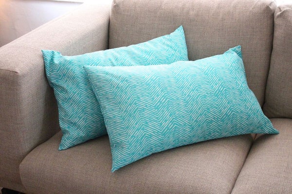 two envelope pillow cover on the sofa