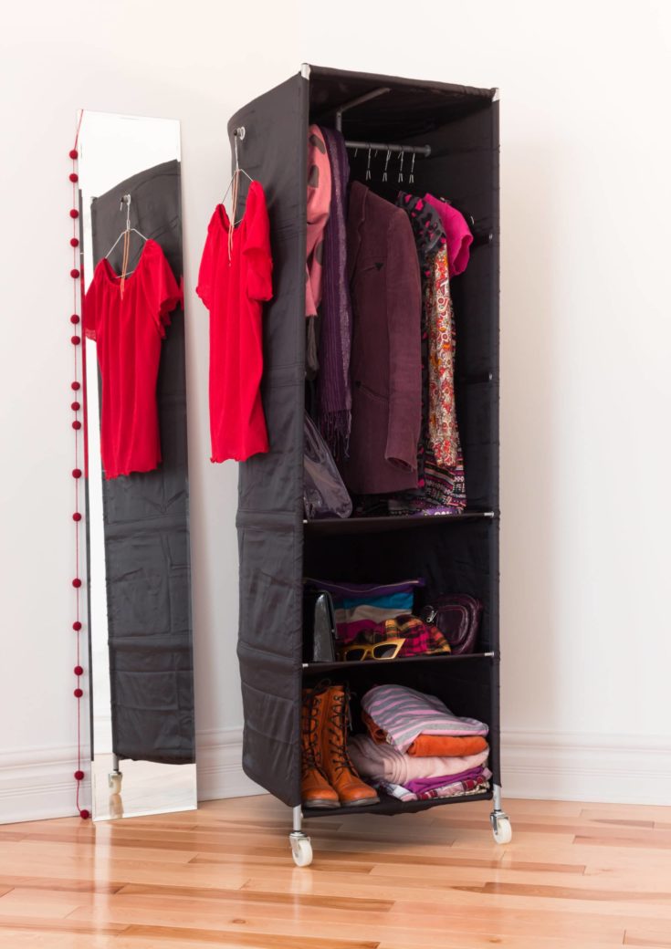 Mobile clothes organizer with red and purple clothing and accessories.