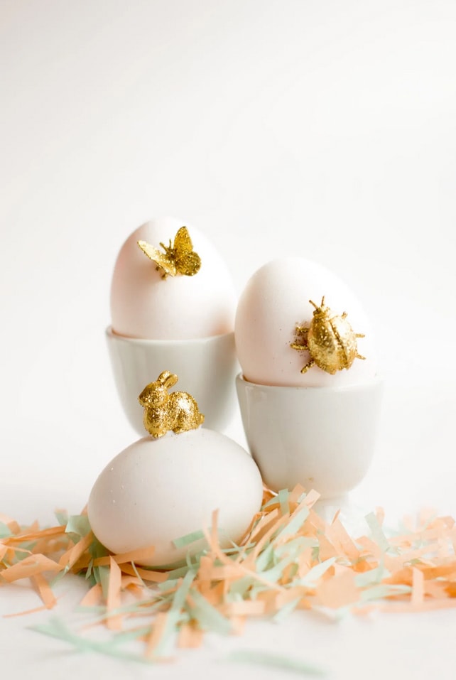 3 easter eggs with Gold Animal DIY toppers in white background