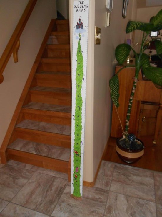 Growth chart standing beside a stair