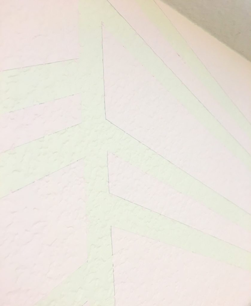 3D wall coated with three layers of paint making one color pop out.