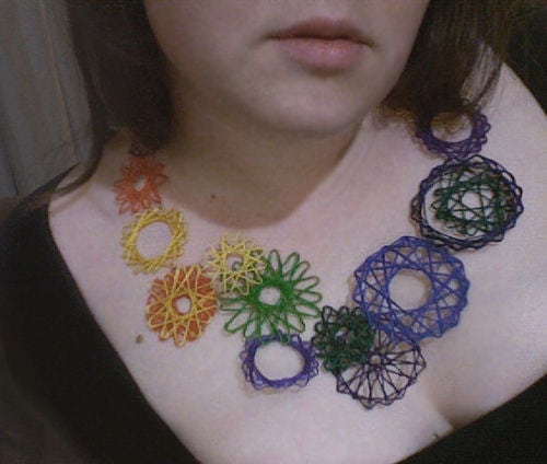 Neck Art using string of different colors.