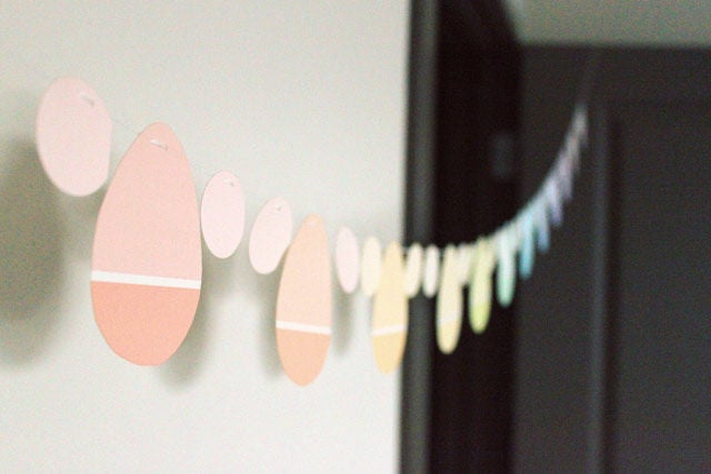 Paint chip easter egg party garland hanging on a wall.