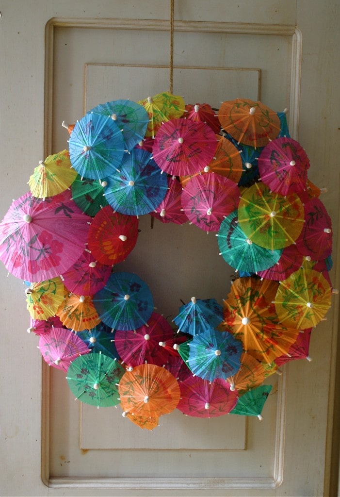 Paper Umbrella Wreath hanged on a wooden door