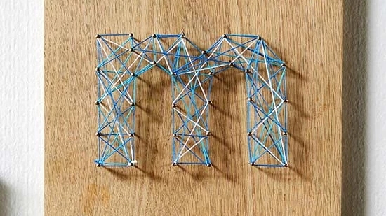 Personalize "M" string art design.