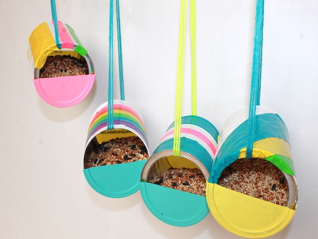 colurful Recycled Can Bird Feeder in white wall background