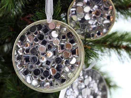 Mason Jars Lids decorated with rhinestones hang on Christmas tree