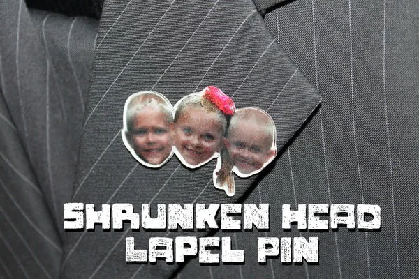 Shrunken Head Lapel Pins on a coat