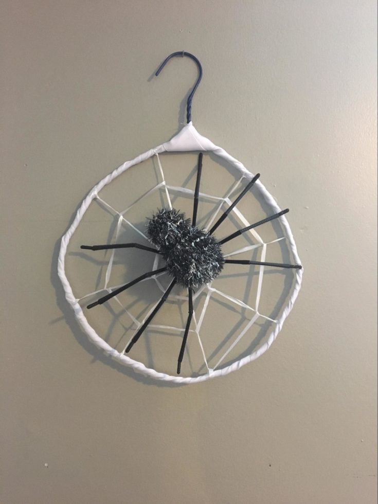 a custom made Spiderweb Dreamcatcher using a hanger with big spider on the center