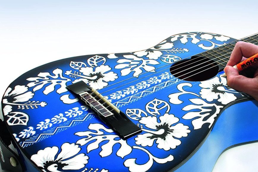 Man's hand painting the blue guitar