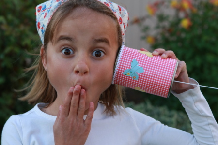 a girl using Tin Can Phone