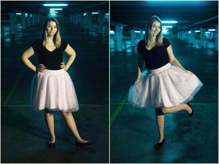 a woman in black shirt and tulle skirt in the parking lot