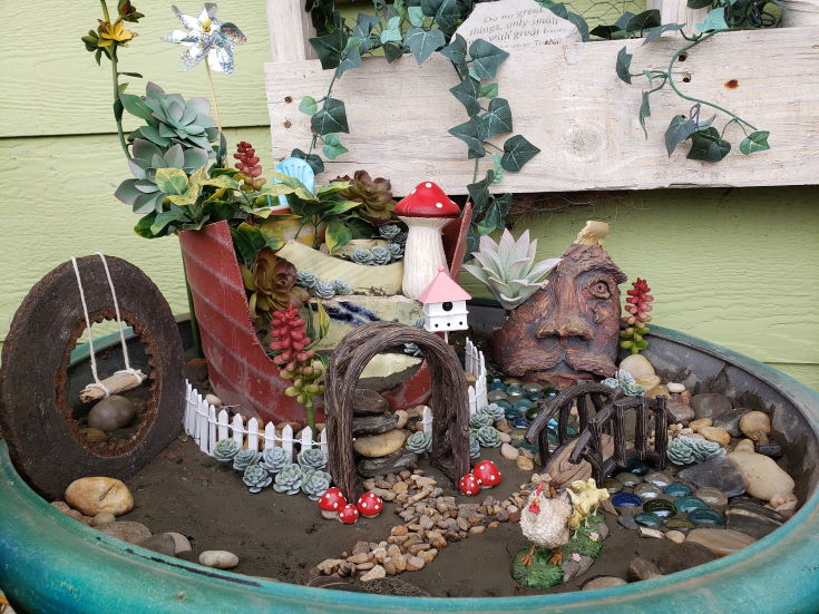 Fairy Garden on large pot, flowers, figurines