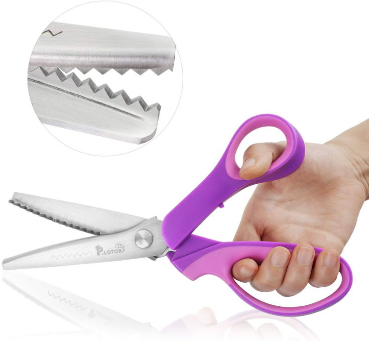 woman's hand holding P.LOTOR Sewing Pinking Shears