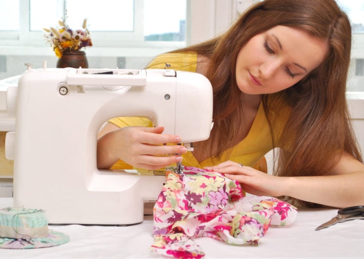 Woman seamstress work on the best quilting sewing machine