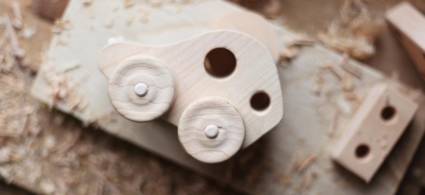 Wood carved toy car.