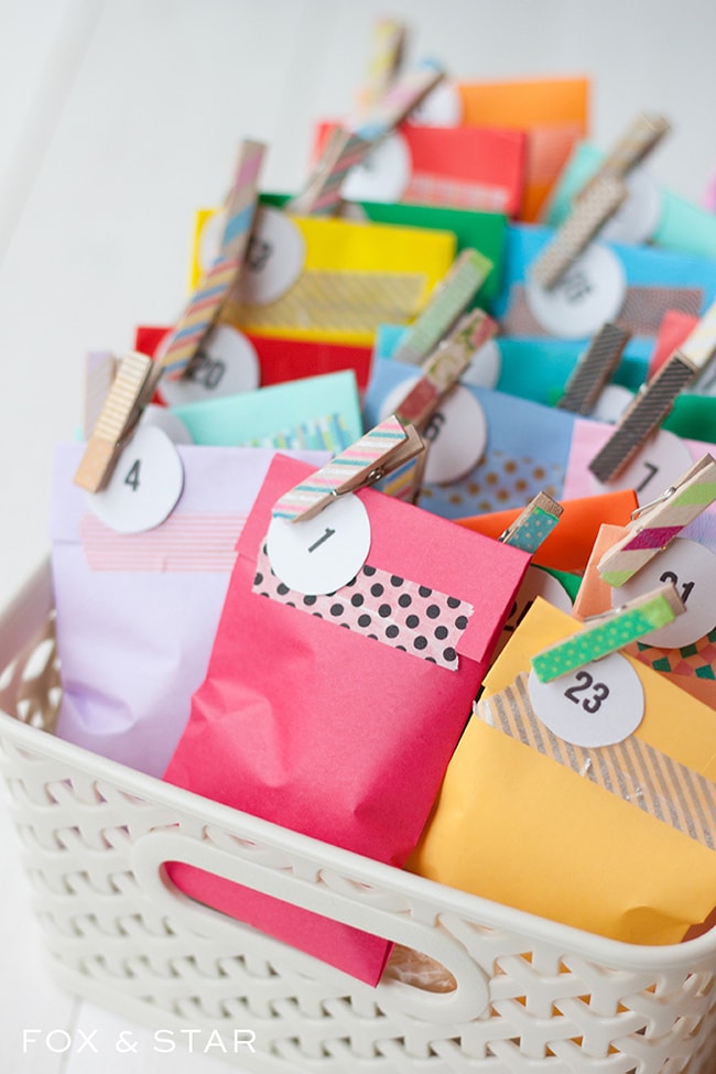 Fox and Star colorful envelops with clothes pins on the corner inside a white plastic basket