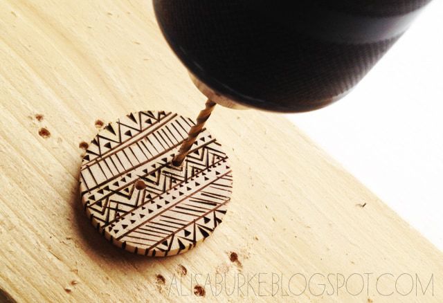 Drilling a hole into a wooden burned button