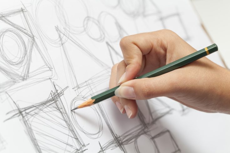 Close-up photograph of a designer making sketch