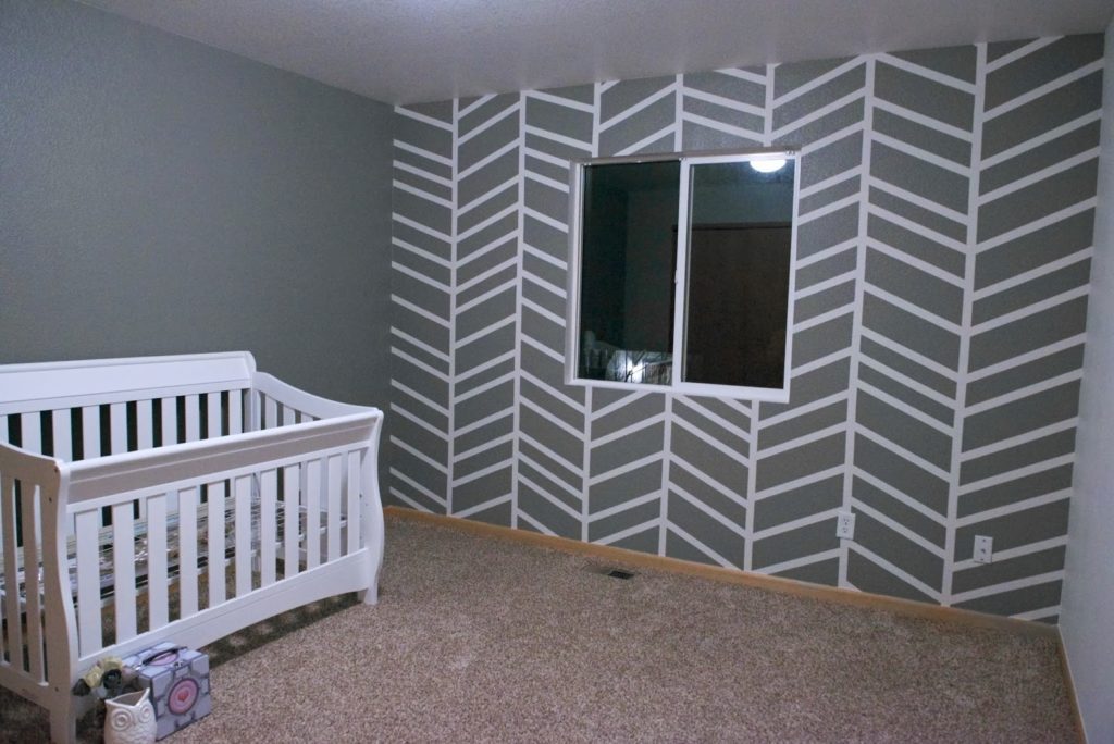 Gray Herringbone with Gray Walls with a crib.