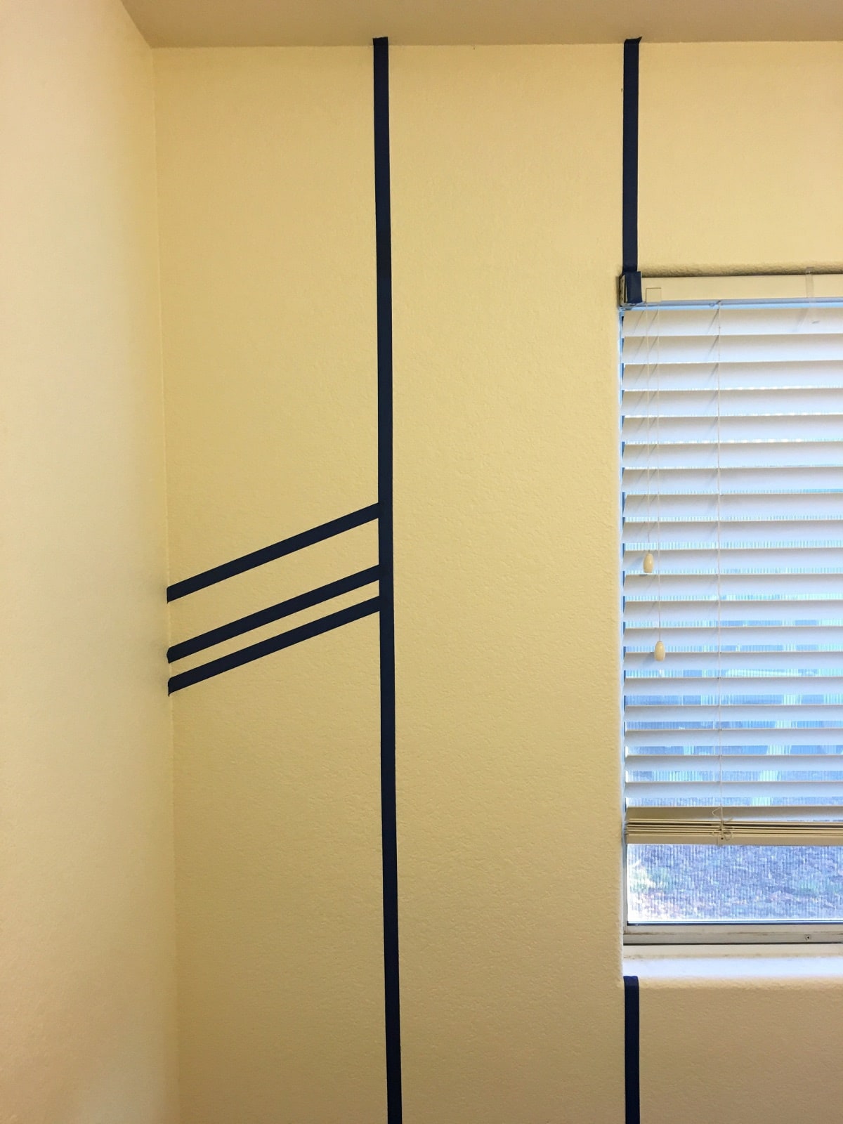 how to paint a herringbone accent wall