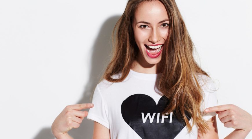 Woman wearing white shirt printed with black heart with word WIFI at the center