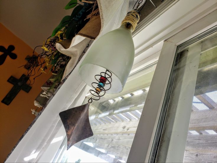 DIY windchime hanging on window.