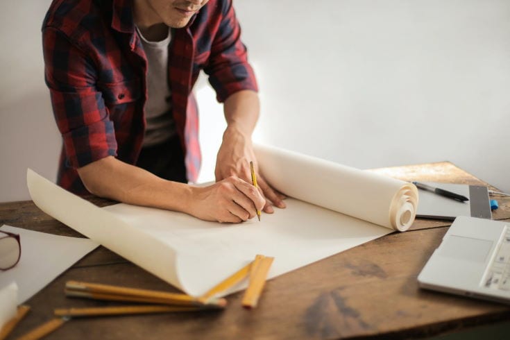 man drafting on the table