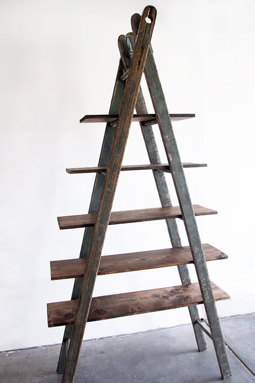 5 layers wooden ladder with white wall background